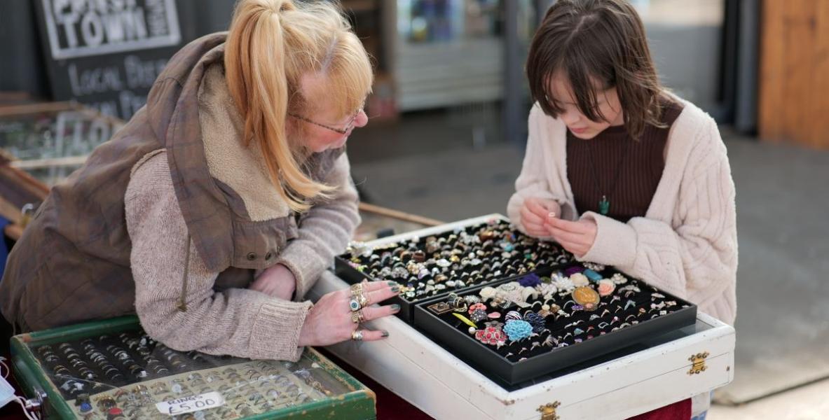 Karens Collectables trader showing customer items for sale