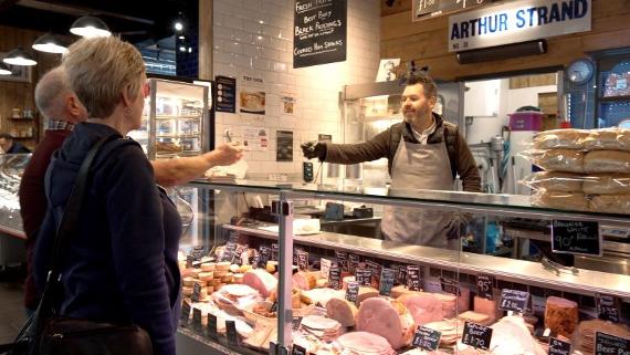 Arthur Strand Trader serving customers