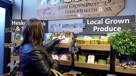 Customer browsing vegetables at Fresh and Fruity