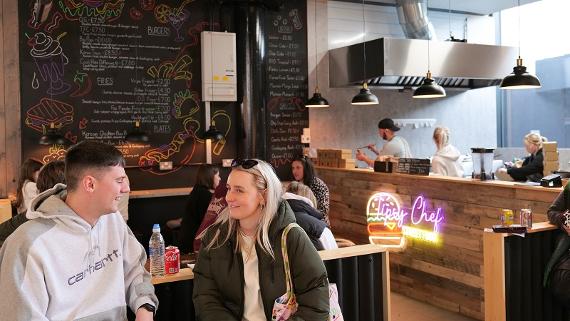 Customers enjoying food and drink at Tipsy Chef