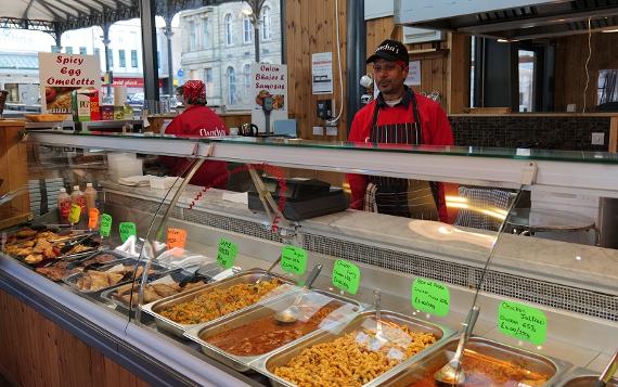 Trader behind stall