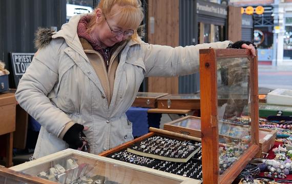 Trader looking at vintage items