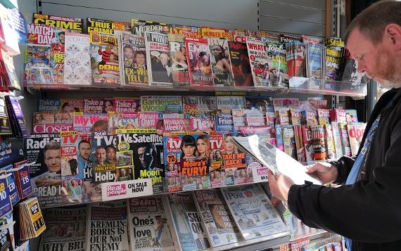 Customer browsing magazines