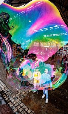 Children creating big bubbles