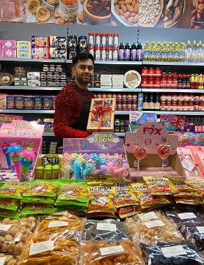 Trader holding food gift package