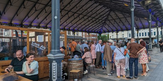 People stood under the canopy