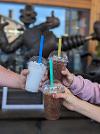People holding slushies close up