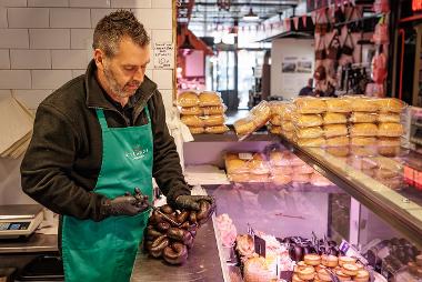 Arthur Strand trader cutting black pudding
