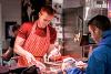 Livesey's butcher trader serving customer