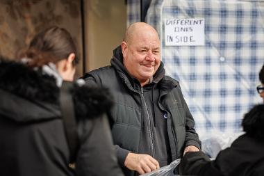 Frank's Beds trader talking to customers