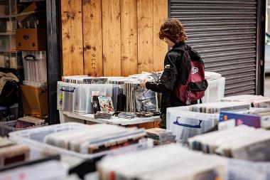 Young person looking through records